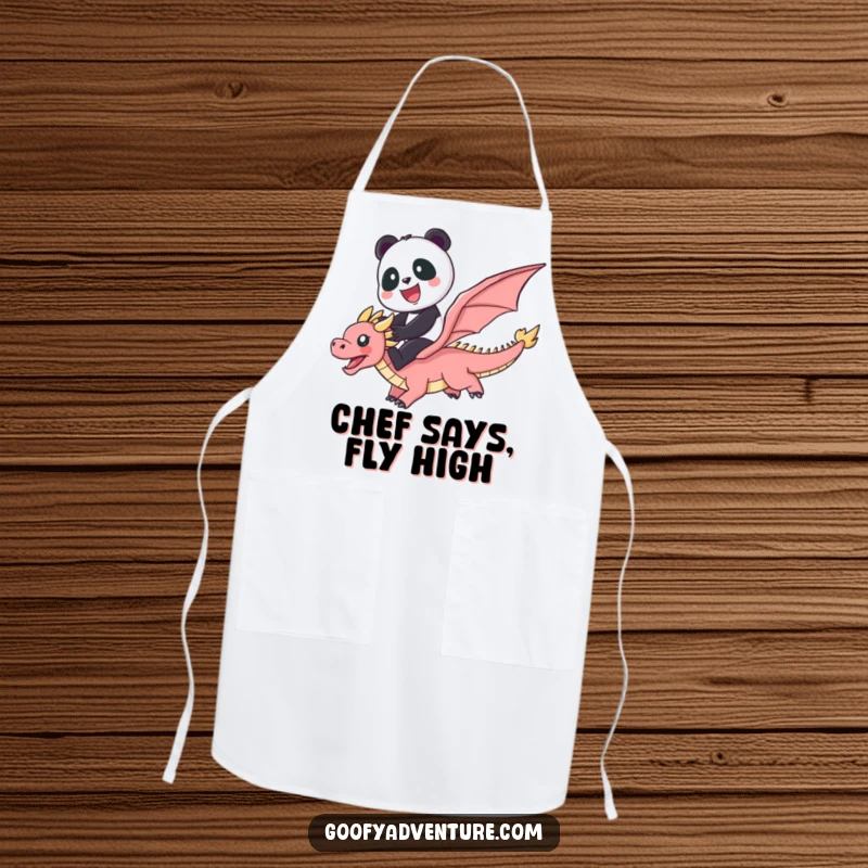Funny kitchen apron featuring a cute panda riding a flying dragon through a vibrant rainbow, great for cooking.
