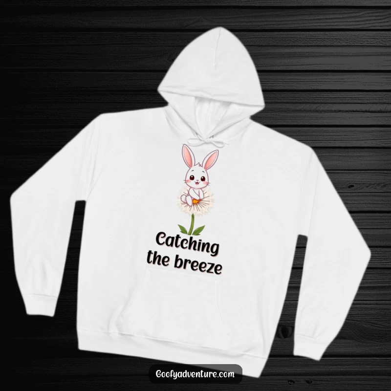 Funny bunny character riding a fluffy dandelion seed, featured on a cozy hoodie, perfect for warmth and laughs, funny gift.