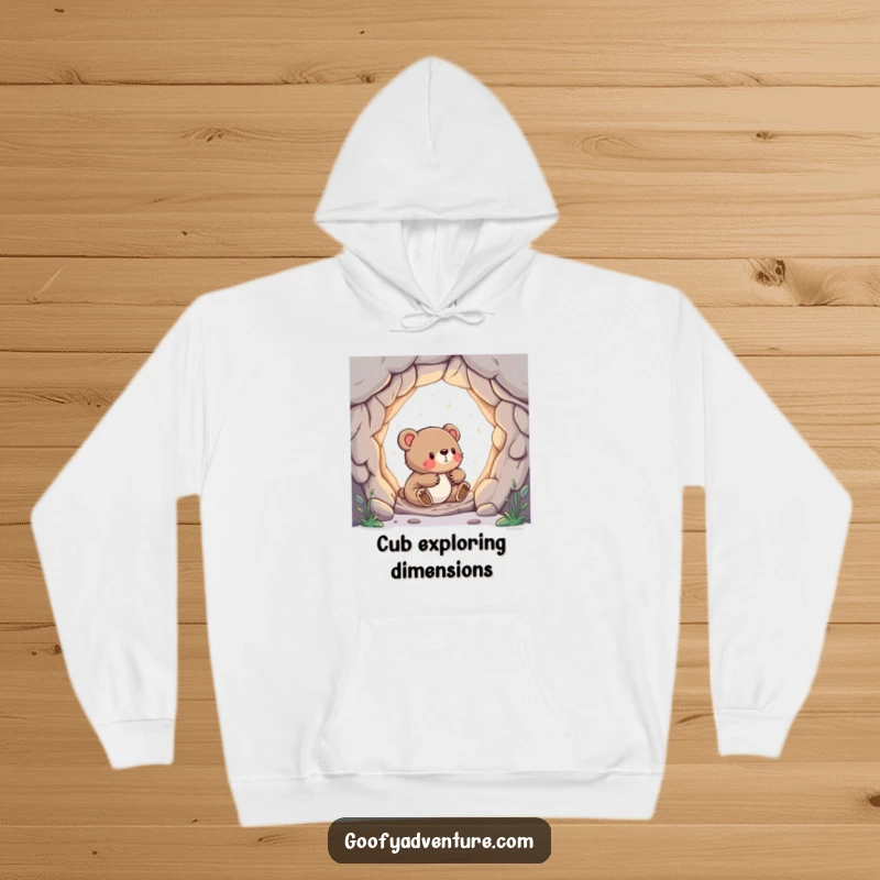 Funny hoodie featuring a curious bear cub peeking into a magical portal that opens to another world.