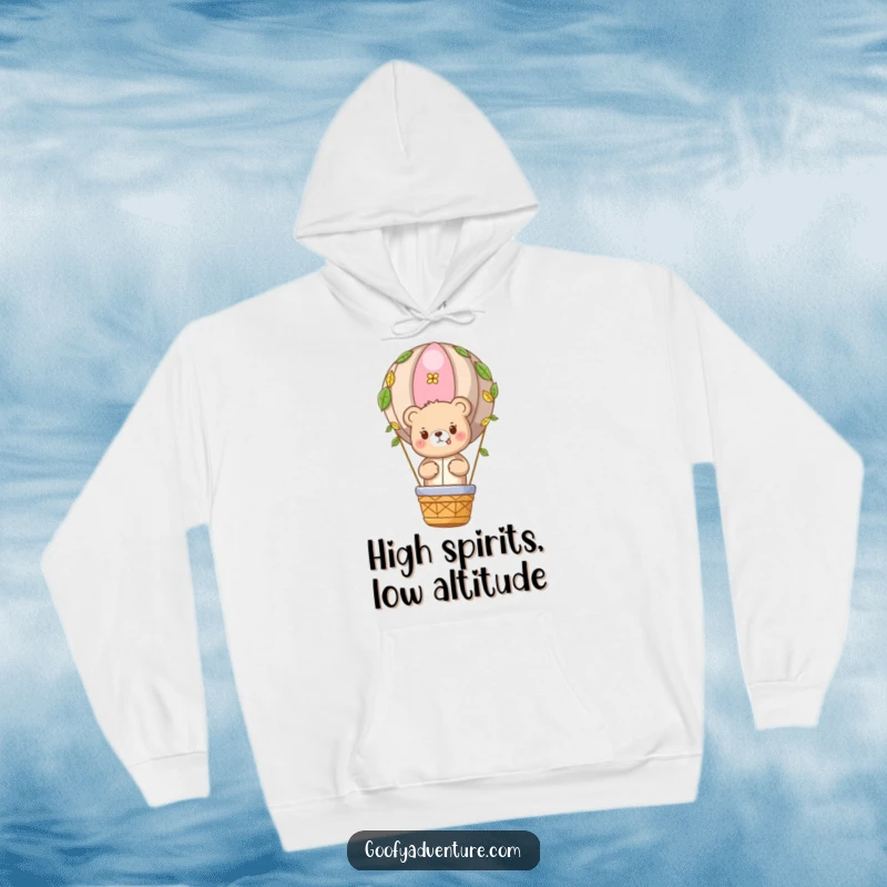 Funny Bear Adventure Hoodie: Cute bear character in a leaf-covered hot air balloon, comfortable and humorous apparel.