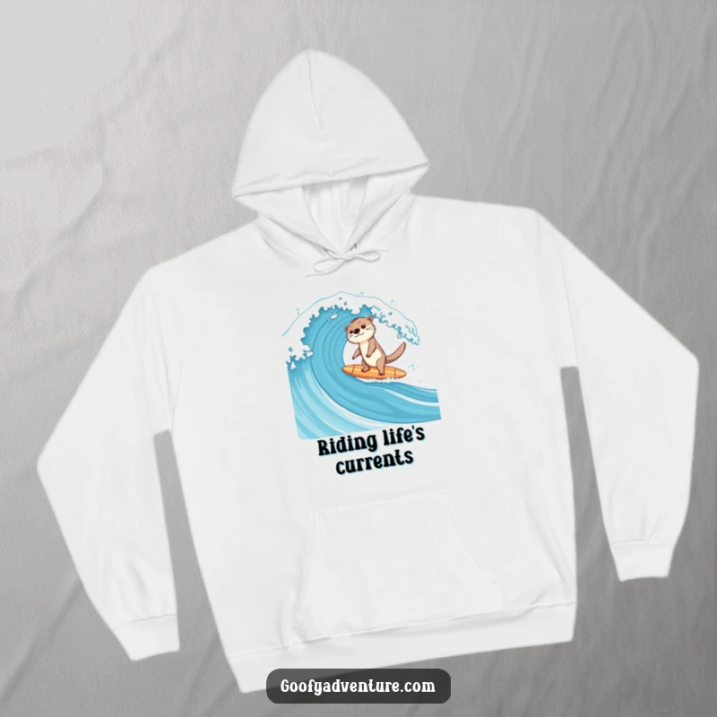 Funny cozy hoodie featuring a happy otter on a surfboard, balancing perfectly on a massive ocean wave.