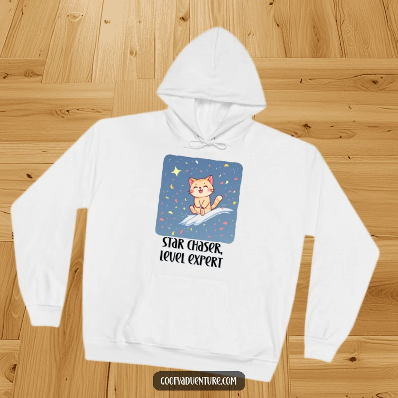 Funny cat hoodie showing a happy cat joyfully riding a swirling confetti wave into a deep, star-filled galaxy. Galactic comfort and humor.