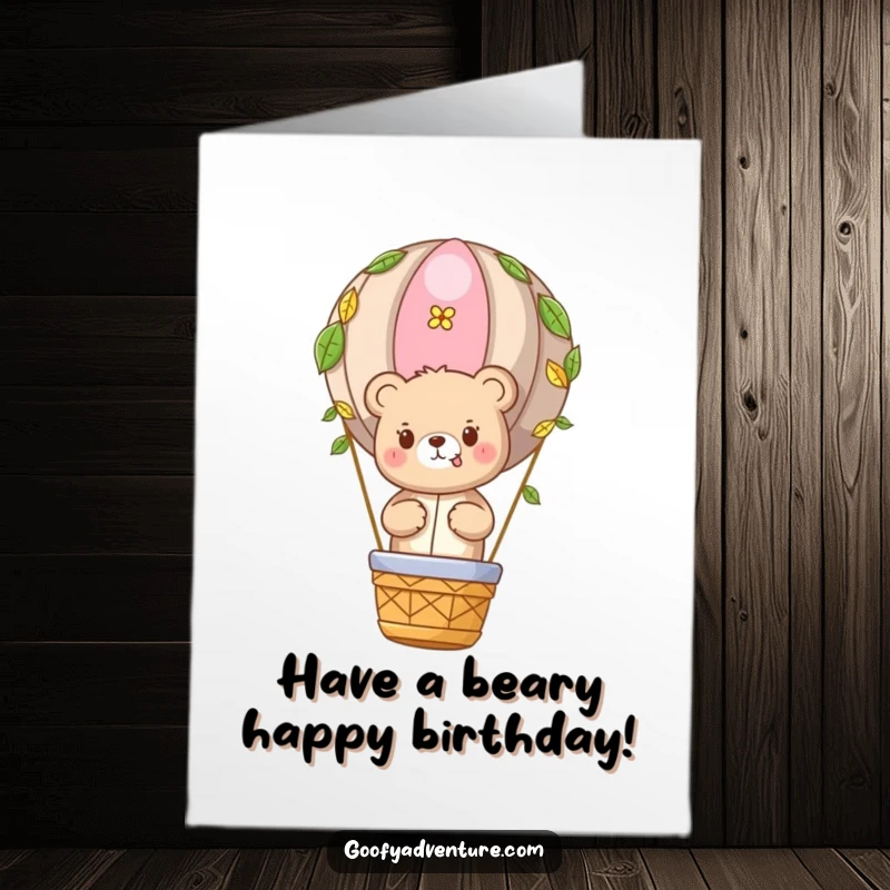 Funny Free Printable Birthday Card: Cute bear character in a hot air balloon adorned with leaves, enjoying the ride.