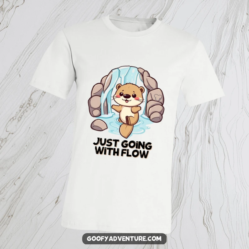 Funny t-shirt featuring a playful otter sliding down a waterfall entrance, highlighting pure joy and energetic aquatic adventure.